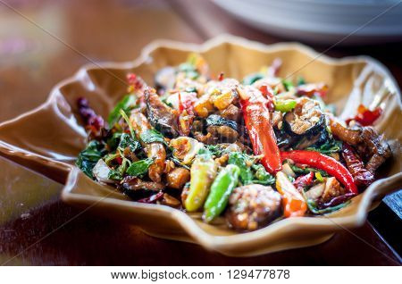 Spicy fried eel on the ceramic plate