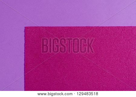 Eva foam ethylene vinyl acetate sponge plush pink surface on light purple smooth background