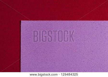 Eva foam ethylene vinyl acetate light purple surface on red sponge plush background