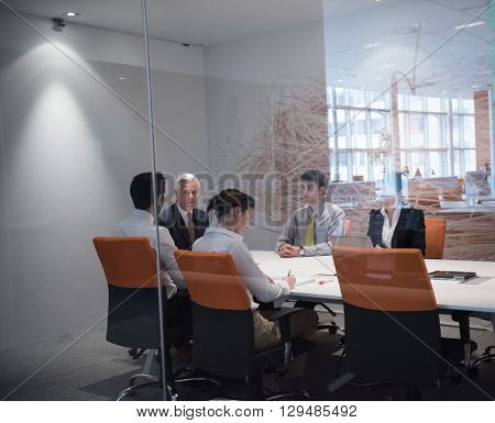business people group brainstorming on meeting and businessman presenting ideas and projects oon laptop and tablet computer