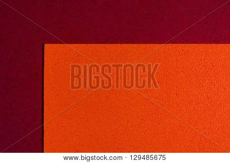 Eva foam ethylene vinyl acetate orange surface on red sponge plush background