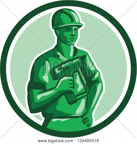 Illustration of a green plastic toy construction worker standing wearing hard hat holding nailgun and other hand on hips set inside circle on isolated background done in retro style.