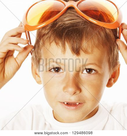 little cute boy in orange sunglasses pointing isolated on white background close up part of face
