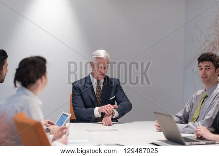 business people group brainstorming on meeting and businessman presenting ideas and projects oon laptop and tablet computer