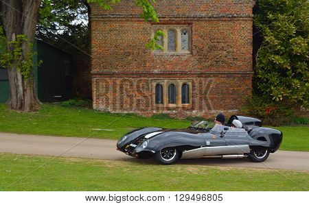 Saffron Walden, Essex, England - April 24, 2016: Classic Black Lotus racing car in front of old building.