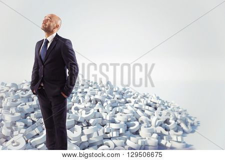 Businessman with a white question marks stack