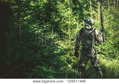 Soldier Mission in the Forest. Army Concept Photo.