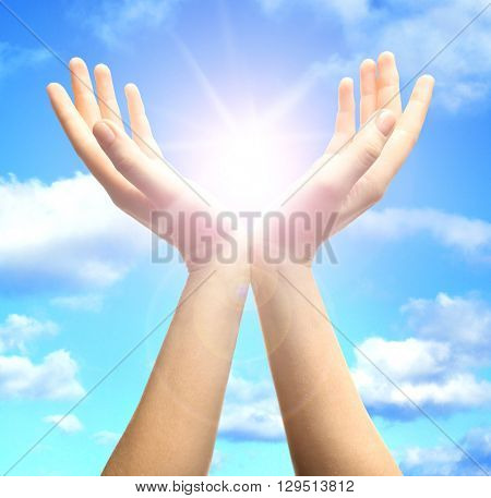 Female hands with sun