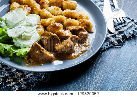 Italian Potato Dumplings With Stew And Cucumber Salad