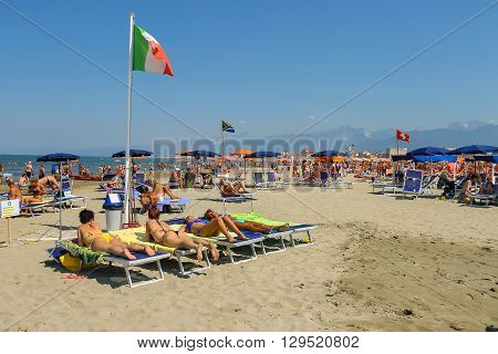Viareggio Italy - June 28 2015: People resting on the beach. Viareggio is the famous resort on the coast of the Ligurian Sea