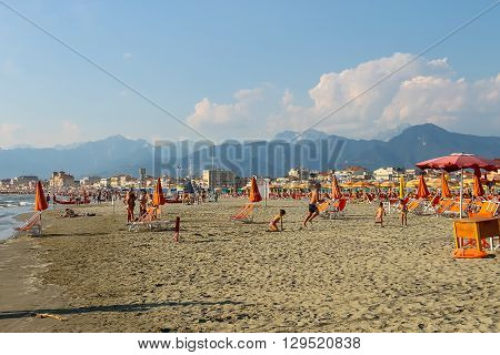 Viareggio Italy - June 28 2015: People resting on the beach. Viareggio is the famous resort on the coast of the Ligurian Sea