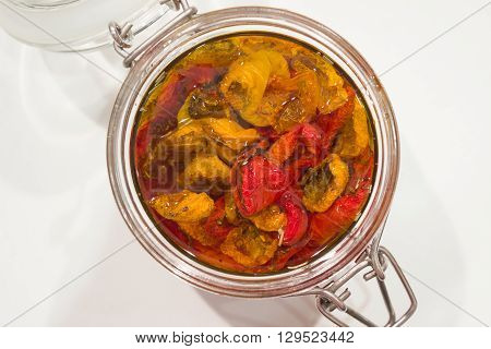 homemade dried tomatoes in clear glass jar