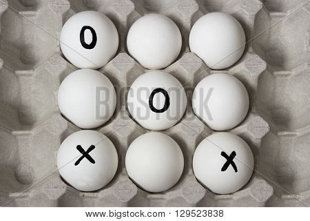 Beginning of the game. Drawing on eggs - tic-tac-toe game