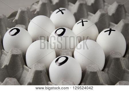 WIN. Drawing on white  eggs - tic-tac-toe game