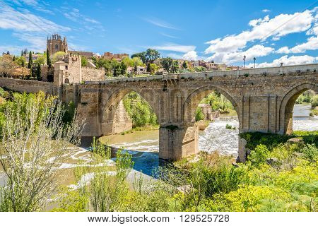 TOLEDO,SPAIN - APRIL 23,2016 - Bridge San Martin over river Tajo in Toledo. Toledo is a municipality located in central Spain.