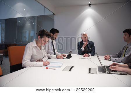 business people group brainstorming on meeting and businessman presenting ideas and projects oon laptop and tablet computer