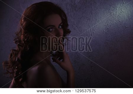 Nude Body Of The Beautiful Girl Over Dark Background