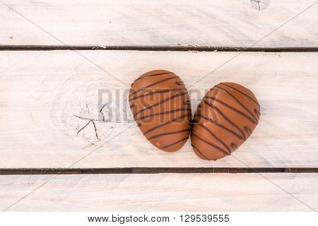 Chocolate Eggs On A Wooden Table