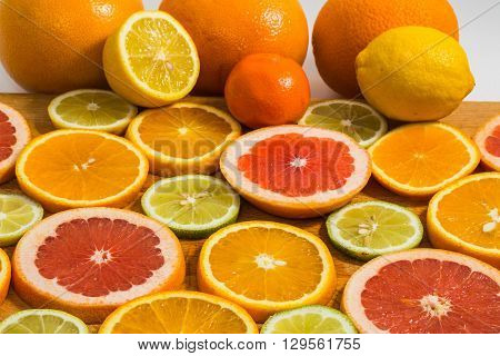 Citrus Fruit Background With Sliced F Oranges Lemons Lime Tangerines And Grapefruit