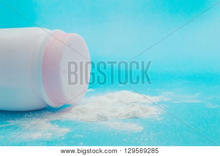 Baby talcum powder container on blue background
