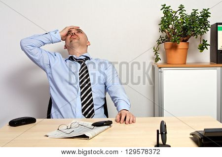 Manager Holds His Head Because Of Bad Share Prices