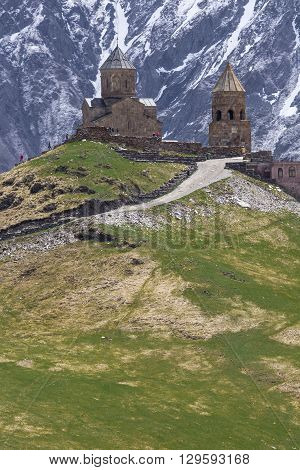 Georgia Stepantsminda-Sameba. Ancient Gergeti Trinity Church high in the mountains.
