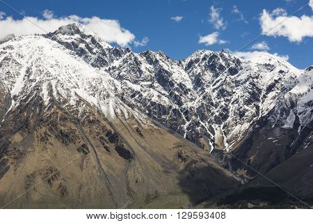 Mountain Landscape In Georgia Kaukaz With Beautiful Sky