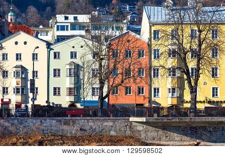 Innsbruck Austria - February 8 2010: The Mariahilf strasse colored houses on the Inn river