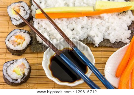 Preparing Sushi. Sushi Rolls And Chopsticks