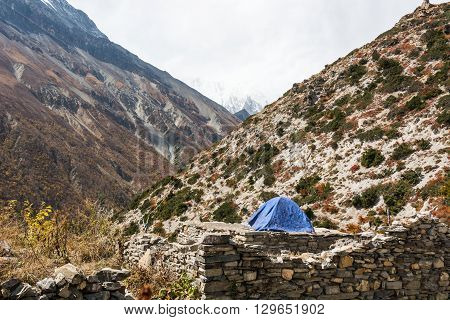 Camping on a deserted ruins in the mountains. Annapurna region in Nepal.