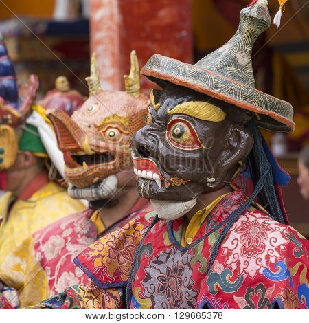 LAMAYURU INDIA - JUNE 13 2015: An unidentified buddhist lamas dressed in mystical mask dancing Tsam mystery dance in time of Yuru Kabgyat Buddhist festival at Lamayuru Gompa Ladakh North India