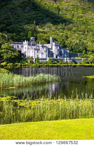 Calway Ireland - August 4 2013: Connemara area the Kylemore abbey on the Pollacappul lake