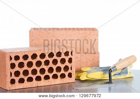 Building material made of bricks and a trowel