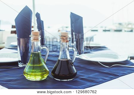 Serving table in the outdoor restaurant on the seaside
