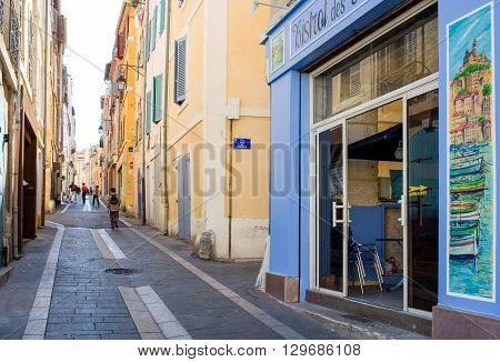 Marseille France - April 29 2006: People and traditional stores in the old district Le Panier