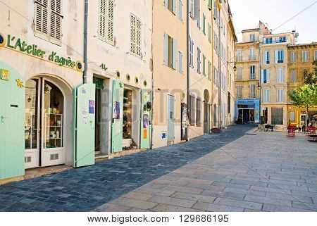 Marseille France - April 29 2006: People and traditional stores in the main square of the old district Le Panier