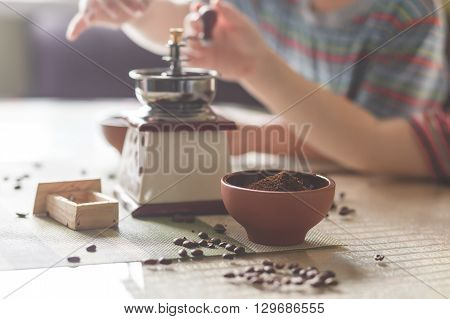 still life with coffee beans and old mill on the table
