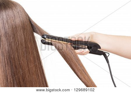 Hairdresser smoothes hair curling isolated on white background