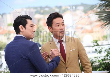 Actor Cho Jin-Woong, Ha Jung-Woo attend 'The Handmaiden (Mademoiselle)' photocall during the 69th annual Cannes Film Festival at the Palais des Festivals on May 14, 2016 in Cannes, France.