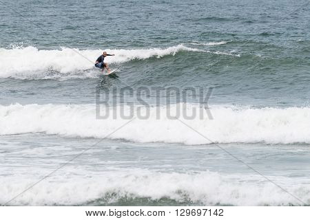 Surfers In Action At The Brava Beach In Florianopolis,