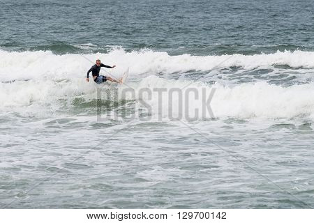 Surfers In Action At The Brava Beach In Florianopolis,