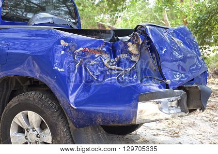 A wrecked car lays in wait after a vicious car accident. 