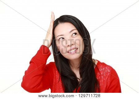 portrait of young Japanese woman has lost her memory on white background
