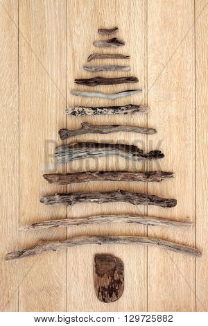 Abstract driftwood tree over oak wood background.
