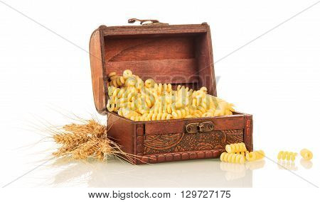 Pasta in the chest and ears of wheat isolated on white background