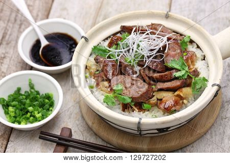 chinese sausage and chicken with rice in clay pot, cantonese food