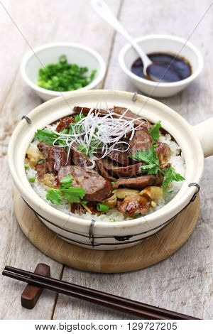 chinese sausage and chicken with rice in clay pot, cantonese food