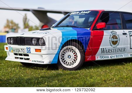 KYIV UKRAINE - April 22 2016: Car BMW e30 M3 at festival of vintage cars OldCarLand-2016 in Kiev. Side view in front.