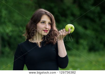 Beautiful Girl Holding A Green Apple