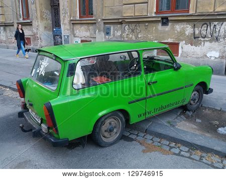 BRNO CZECH REPUBLIC - CIRCA MAY 2016: Green Trabant car parked in a street of the city centre